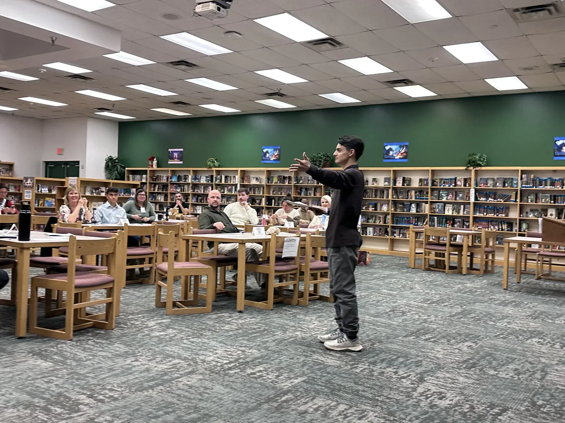 Member giving a speech to the Gilbert Toastmasters club in the library